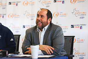 Drew Blass sitting at a table during the OccuNet Classic press conference. Photo Courtesy of www.presspass.news