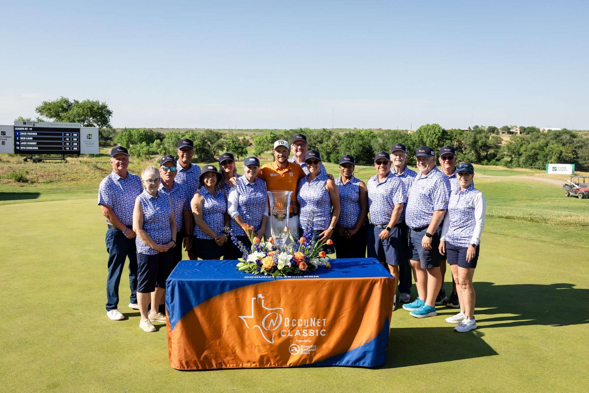 Golf tournament volunteers on the green for a group photo